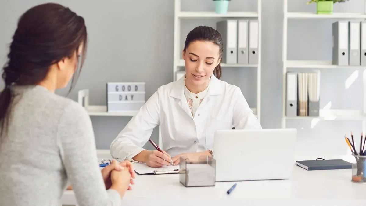 Female Doctor Consulting A Patient At The Clinic