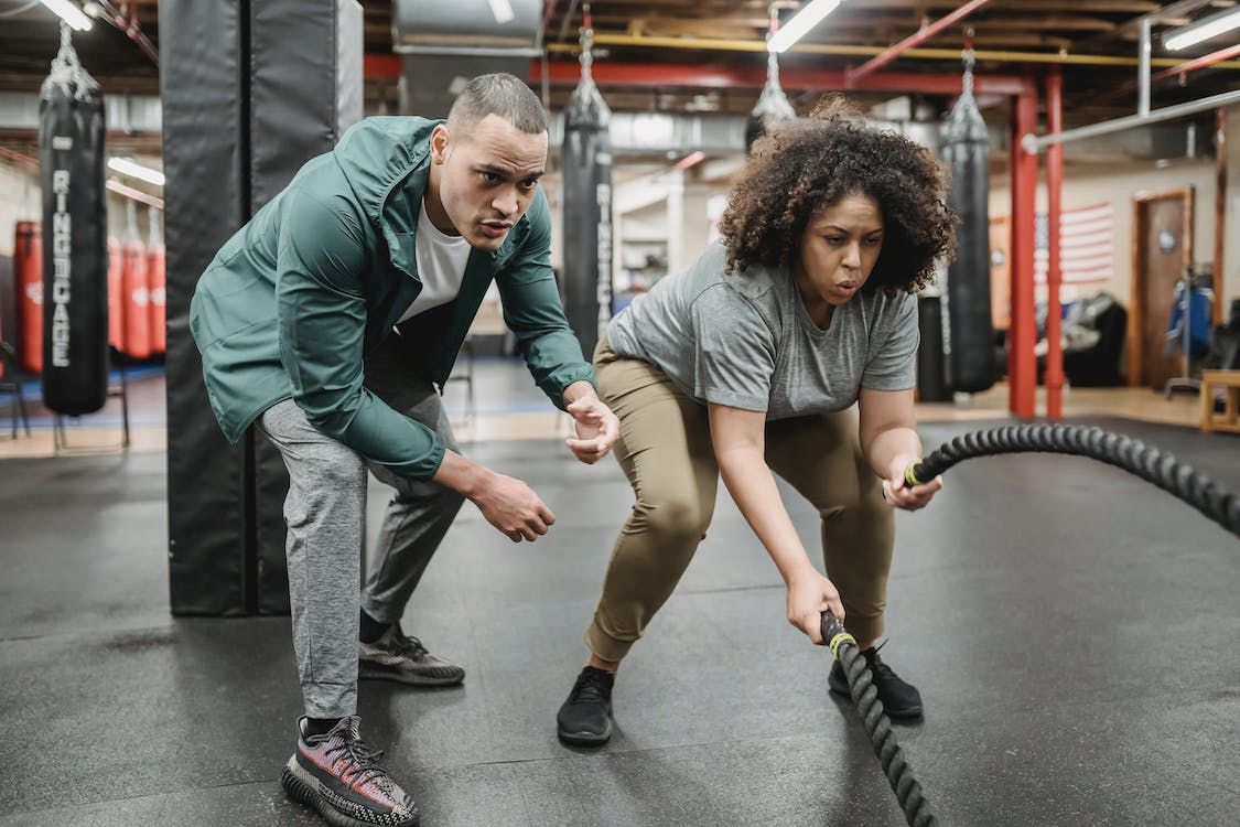 Woman Training With Battle Ropes