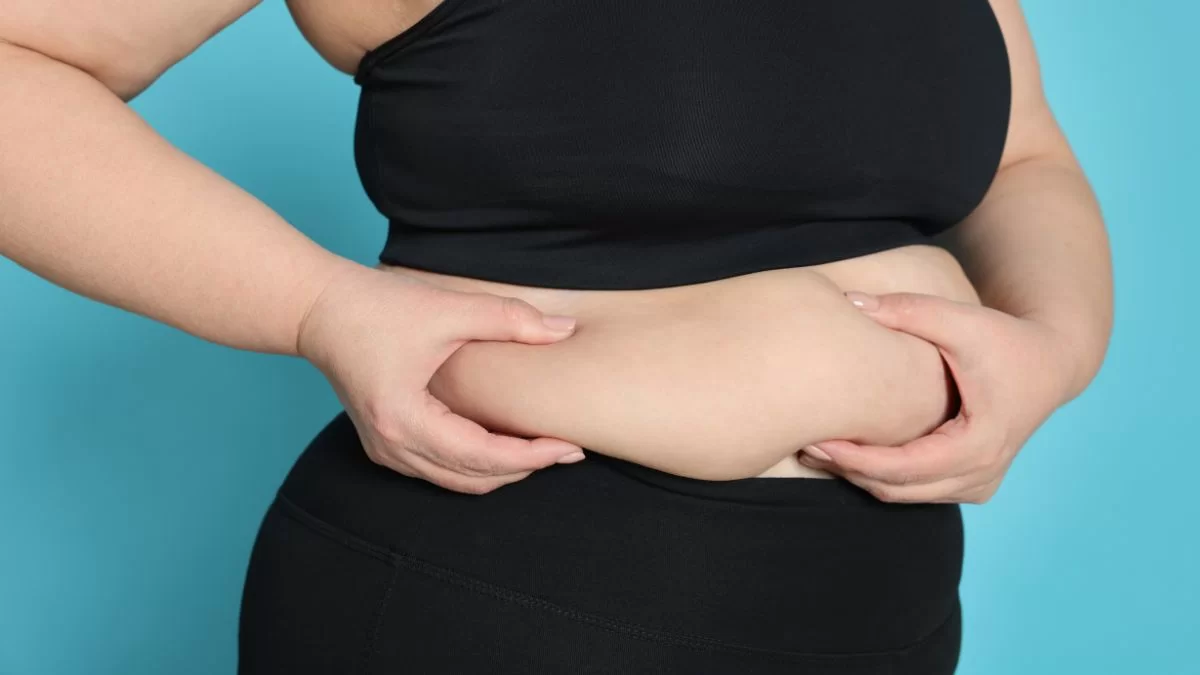 A Woman Checking Her Belly Fat